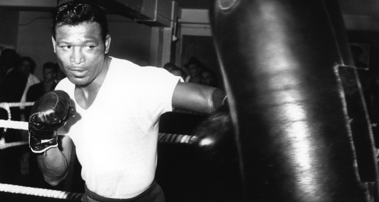 6 SEP 1962:  SUGAR RAY ROBINSON OF THE UNITED STATES IN ACTION PUNCHING A BAG DURING A TRAINING SESSION AT BLOOM's GYMNASIUM IN LONDON's WEST END BEFORE HIS FIGHT AGAINST TERRY DOWNES AT WEMBLEY ON SEPTEMBER 25. Mandatory Credit: Allsport Hulton/Archive