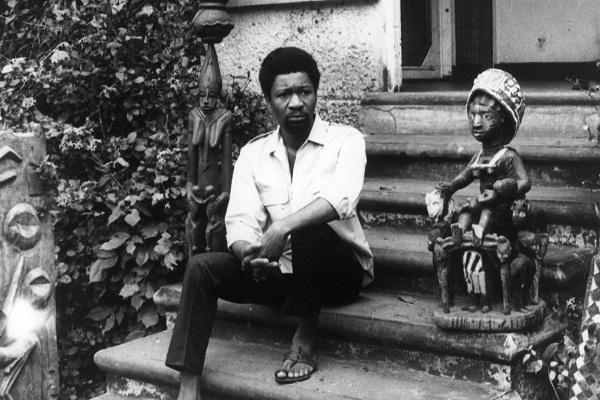 Akinwande Oluwole Soyinka, a lecturer in drama at the Ibadan University, although not a religious man, sits between a god and goddess at his residence in Ibadan, Western Nigeria, a week after he was released from detention for alleged involvement in the Nigeria crisis.    (Photo by Keystone/Getty Images)